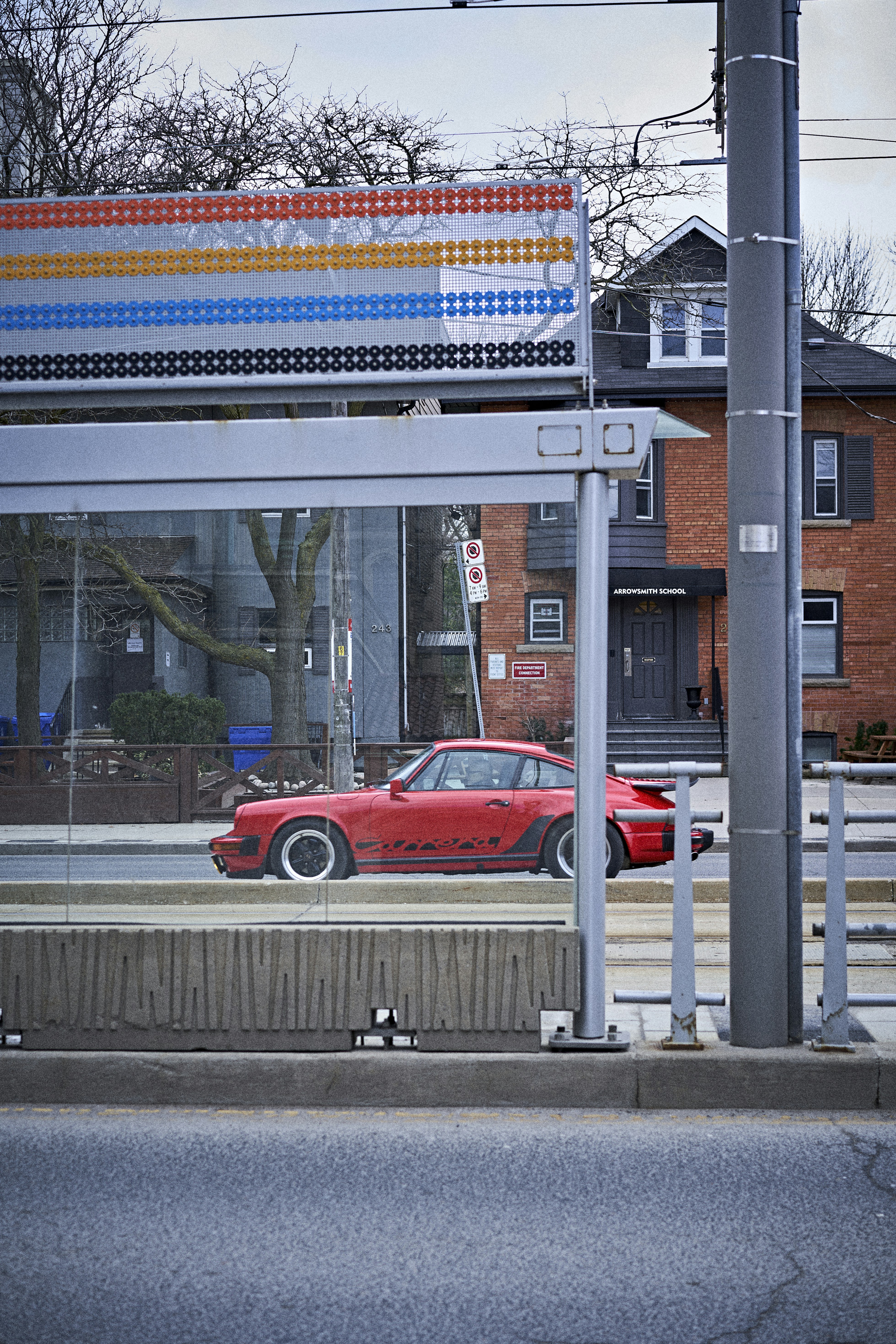 a red car parked on the side of the road