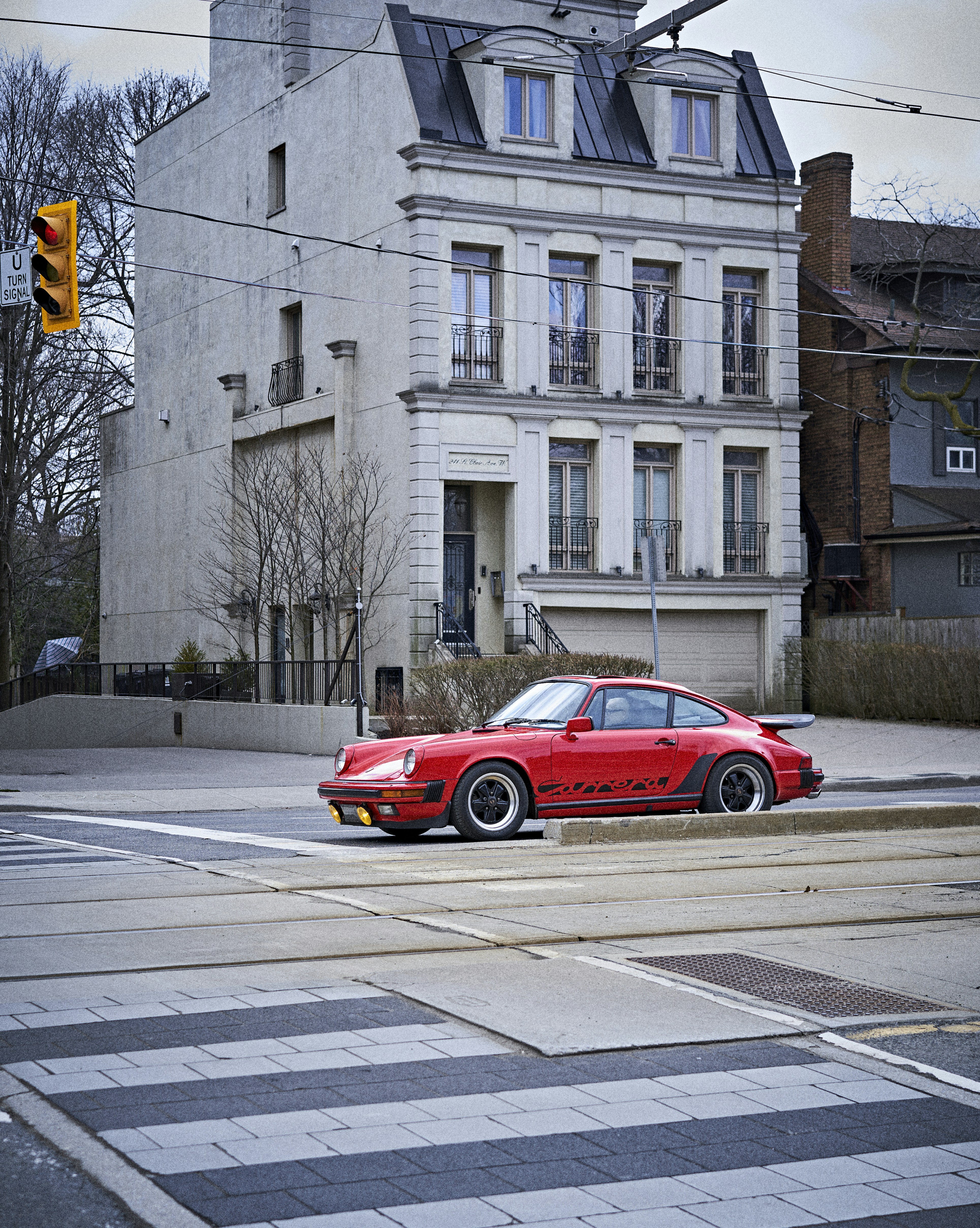 a red sports car parked on the side of the road