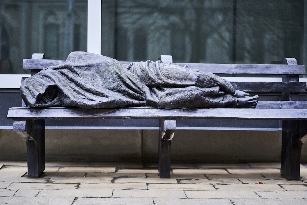 a bench that has a blanket on top of it