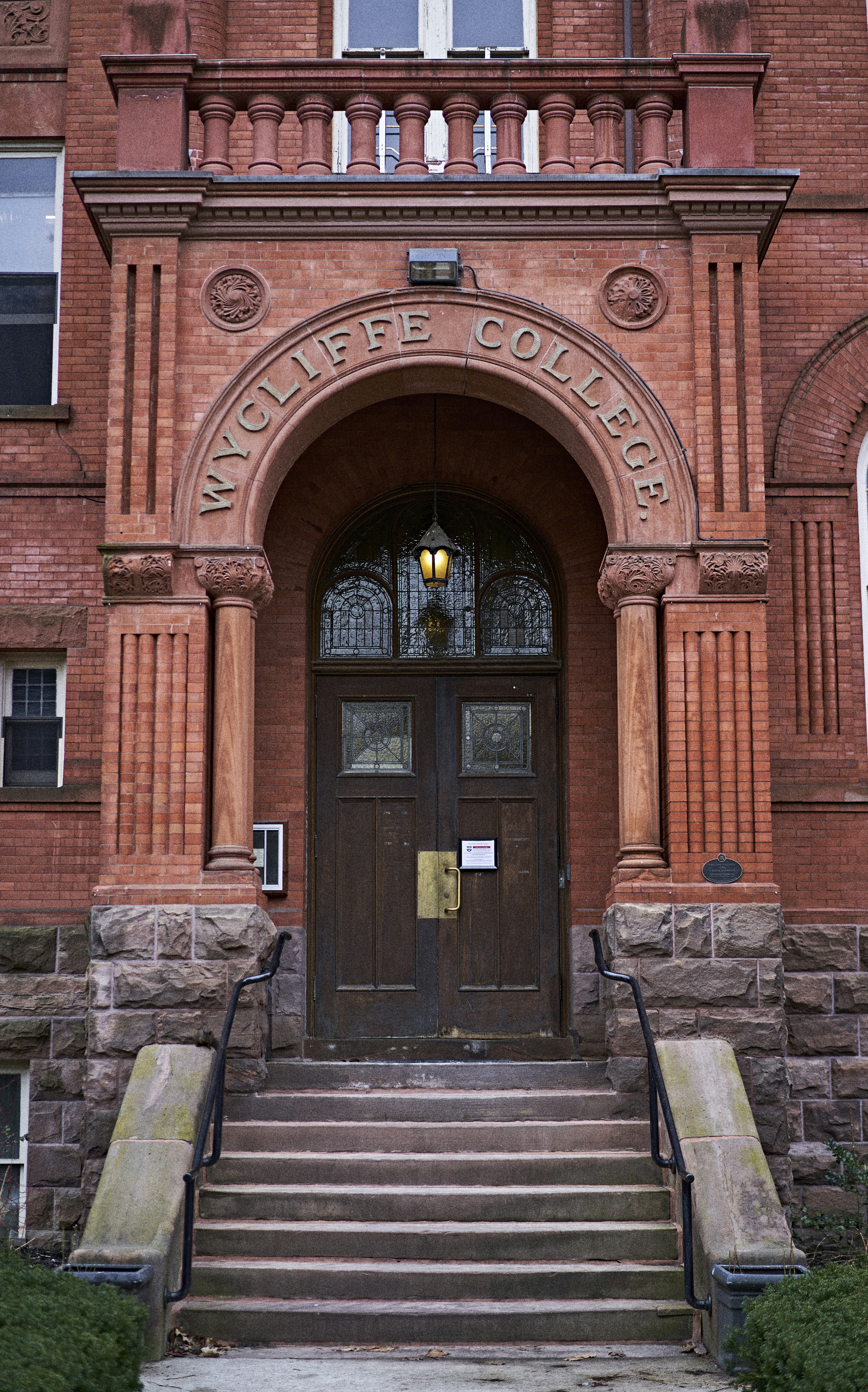 a large brick building with stairs leading up to it