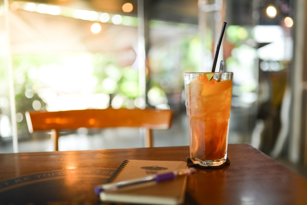 a drink sitting on top of a wooden table