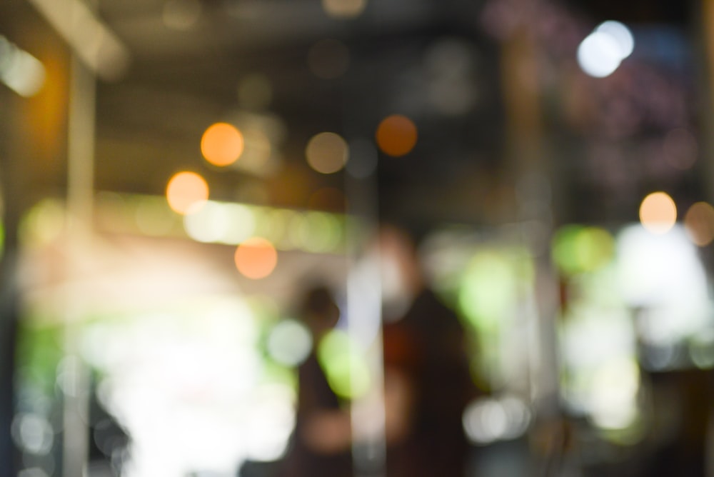 a blurry photo of a person walking down a street