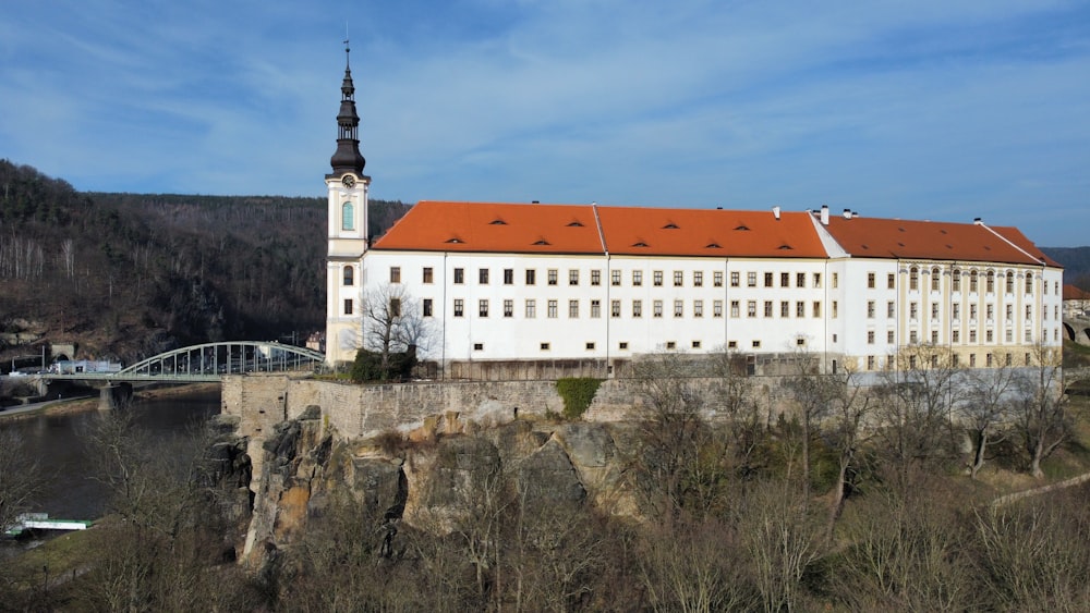 a large white building with a red roof