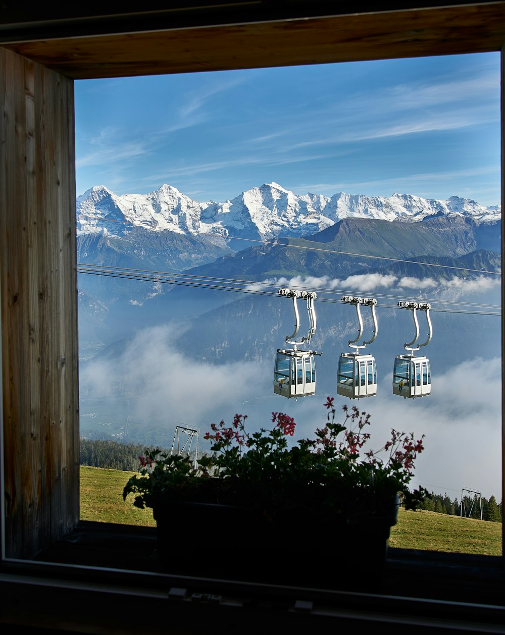 a view of a mountain range from a window