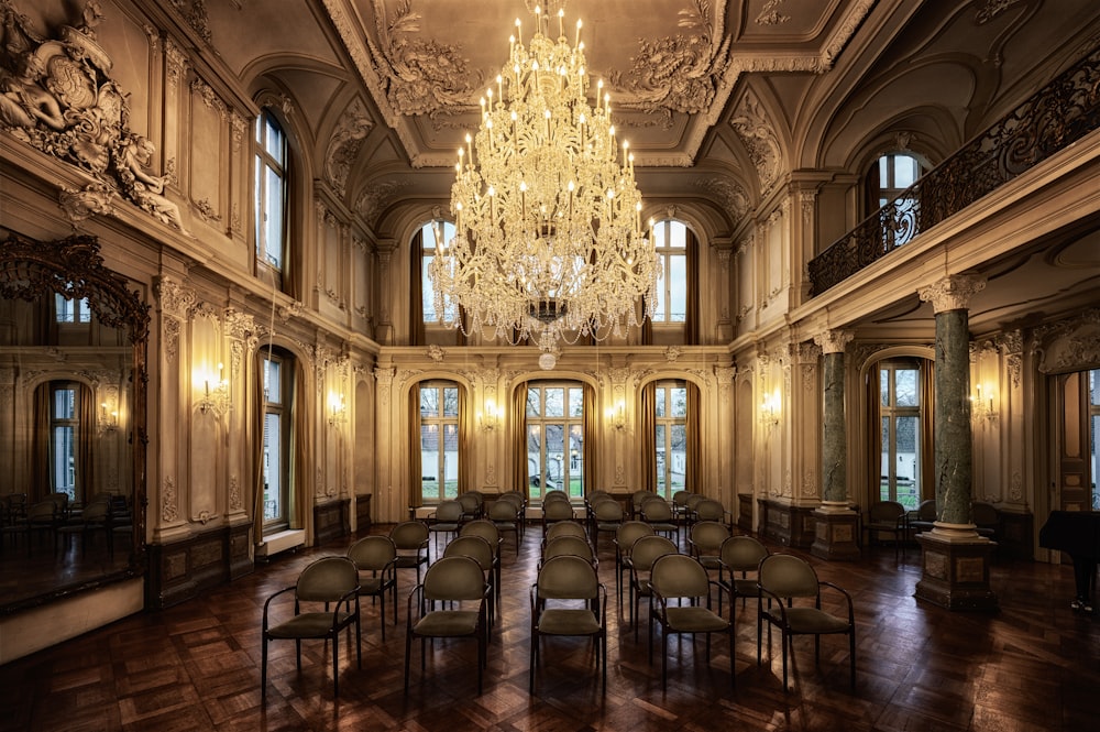 a chandelier hangs from the ceiling in a large room