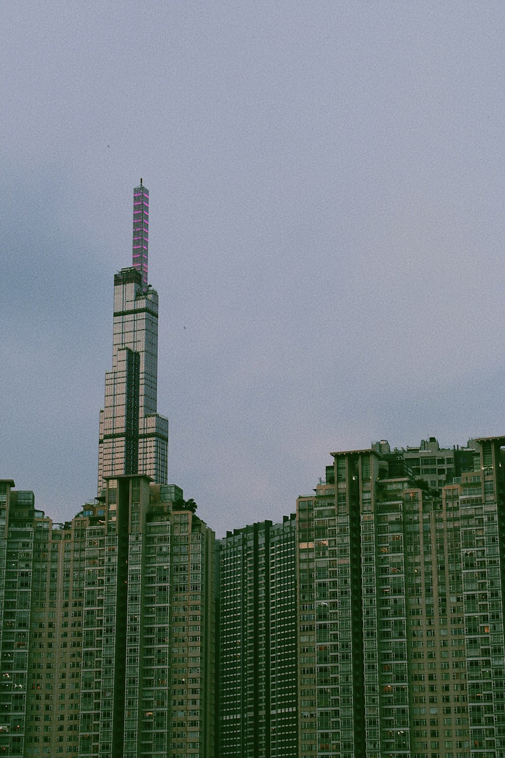 a very tall building with a very tall tower in the background