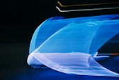 Abstract blue and purple light streaks symbolizing technology and innovation.