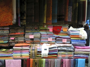 a large amount of cloths and scarves for sale