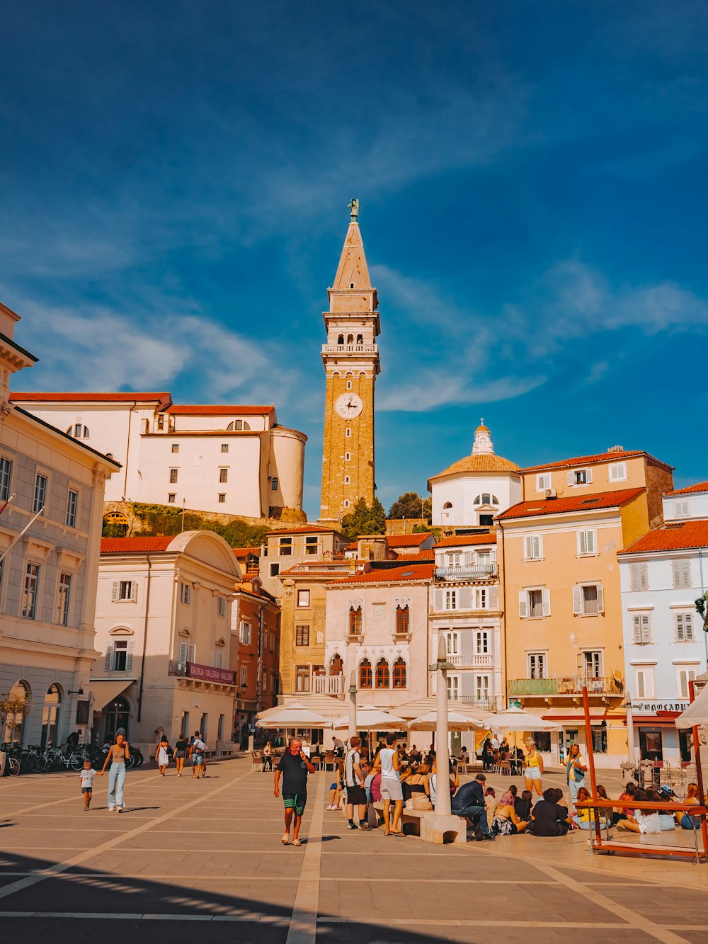 a clock tower towering over a city filled with buildings