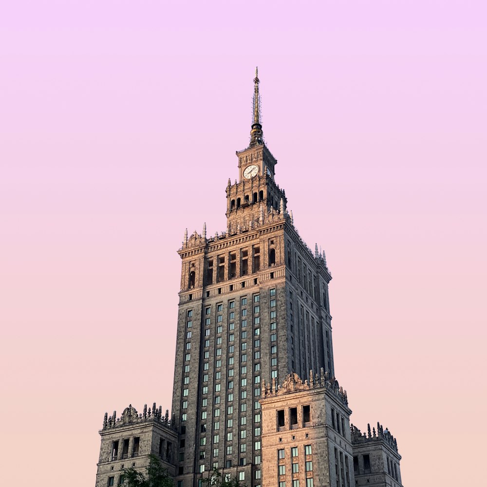 a tall building with a clock on the top of it