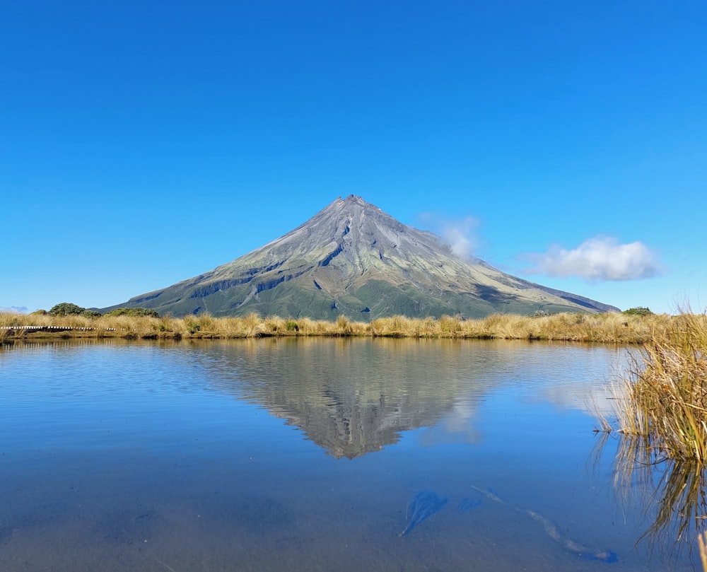 a lake with a mountain in the background