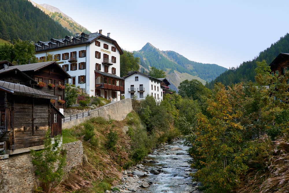 a river running through a lush green hillside