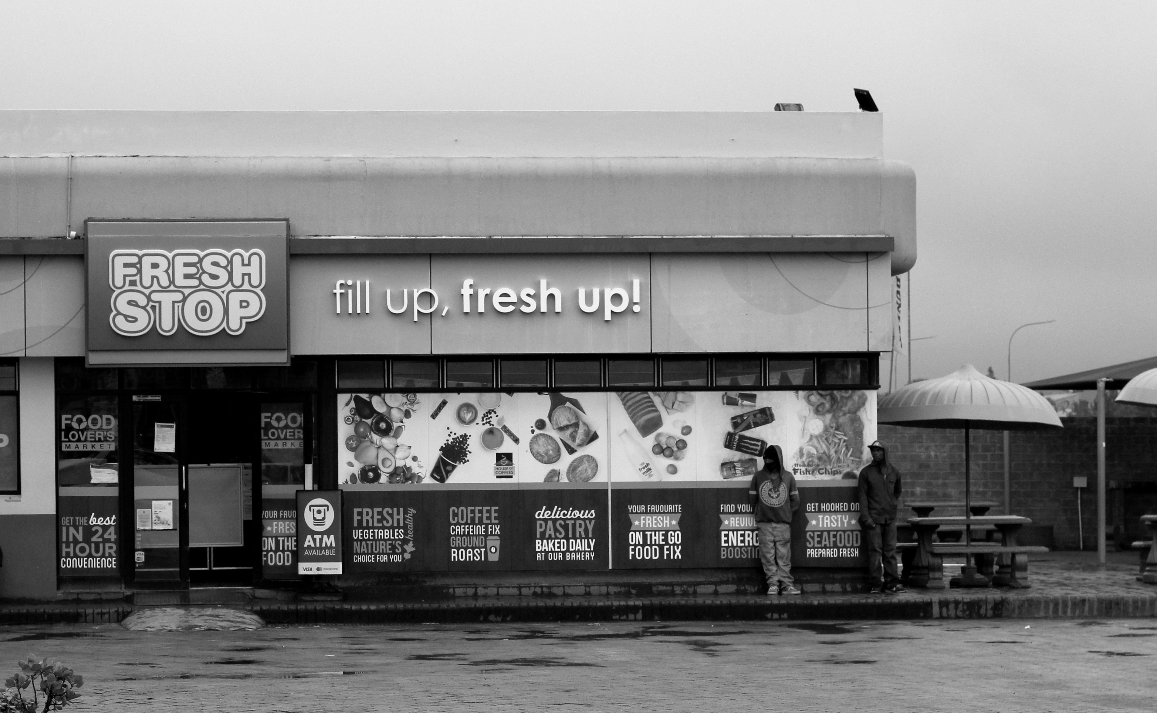a black and white photo of a store front