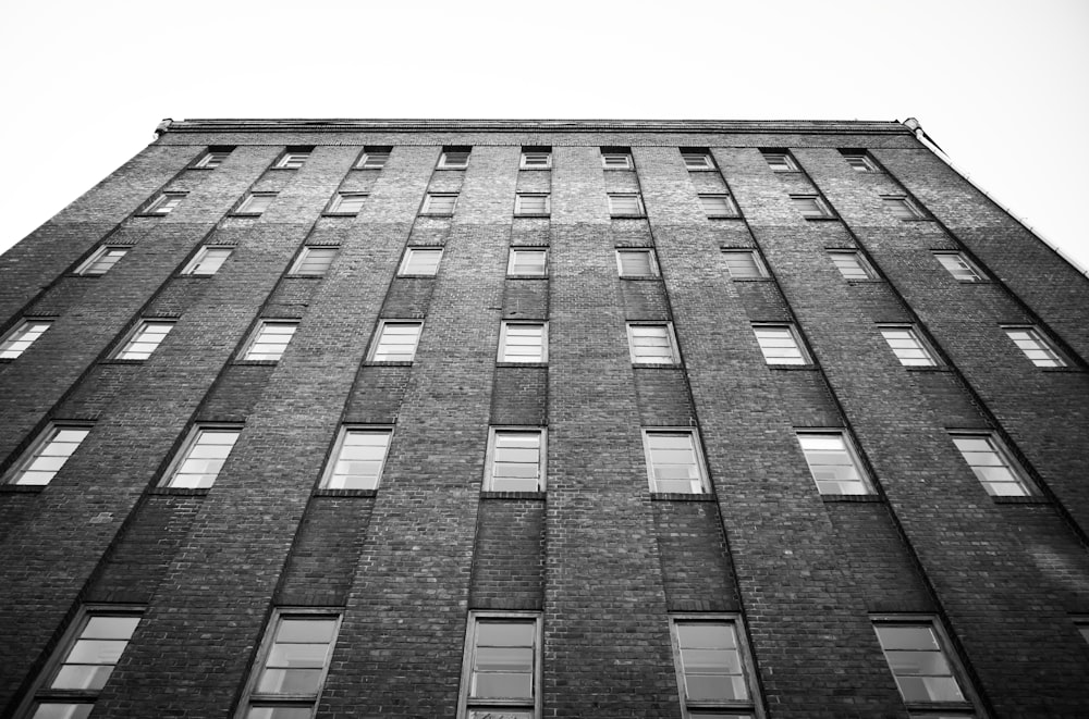 a tall brick building with lots of windows