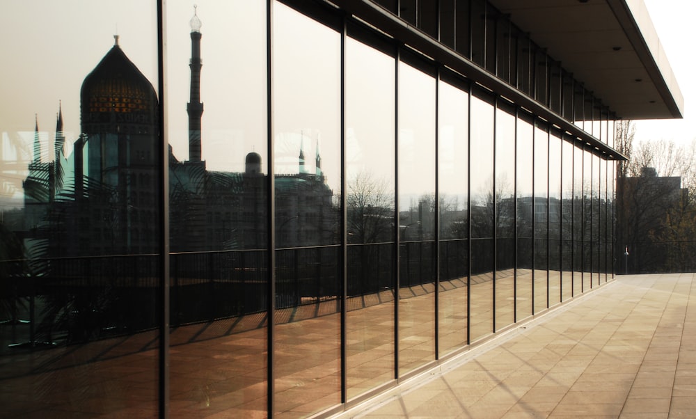 the reflection of a building in the windows of another building