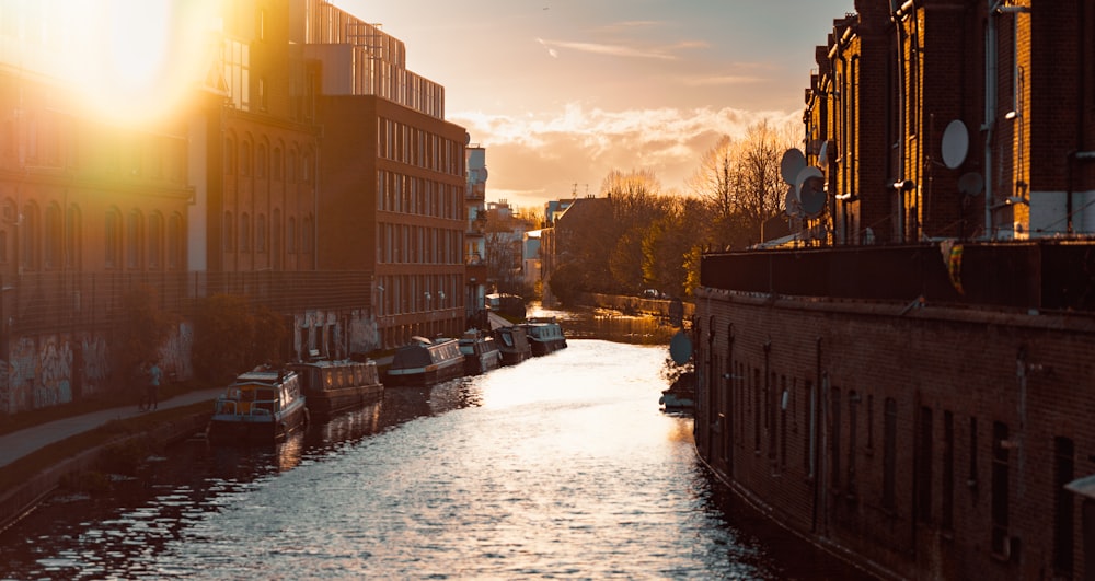 a river running through a city next to tall buildings