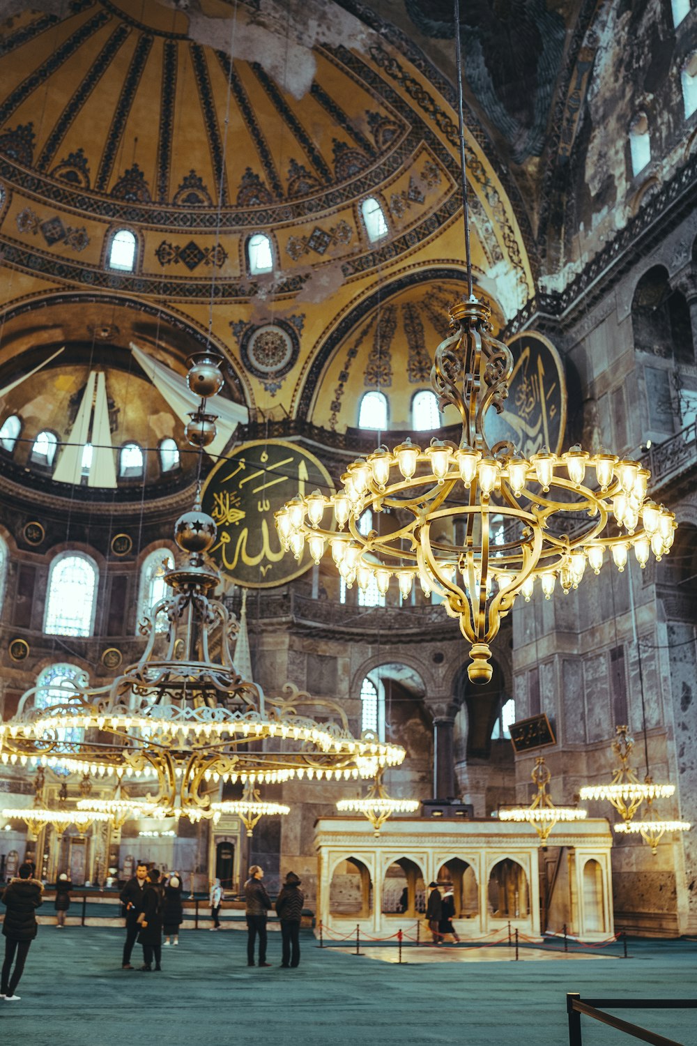 a group of people standing inside of a large building