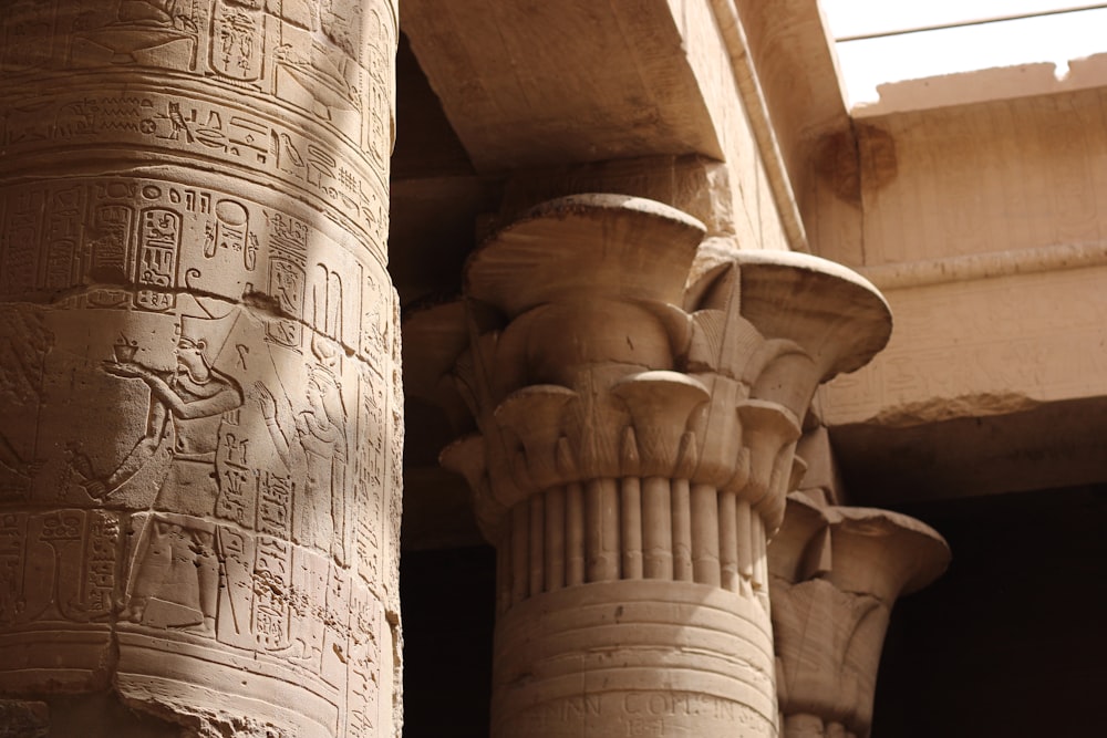 a close up of a pillar with carvings on it