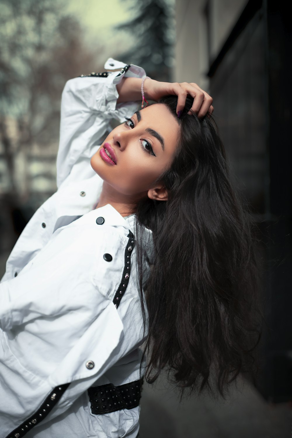 a woman with long hair posing for a picture