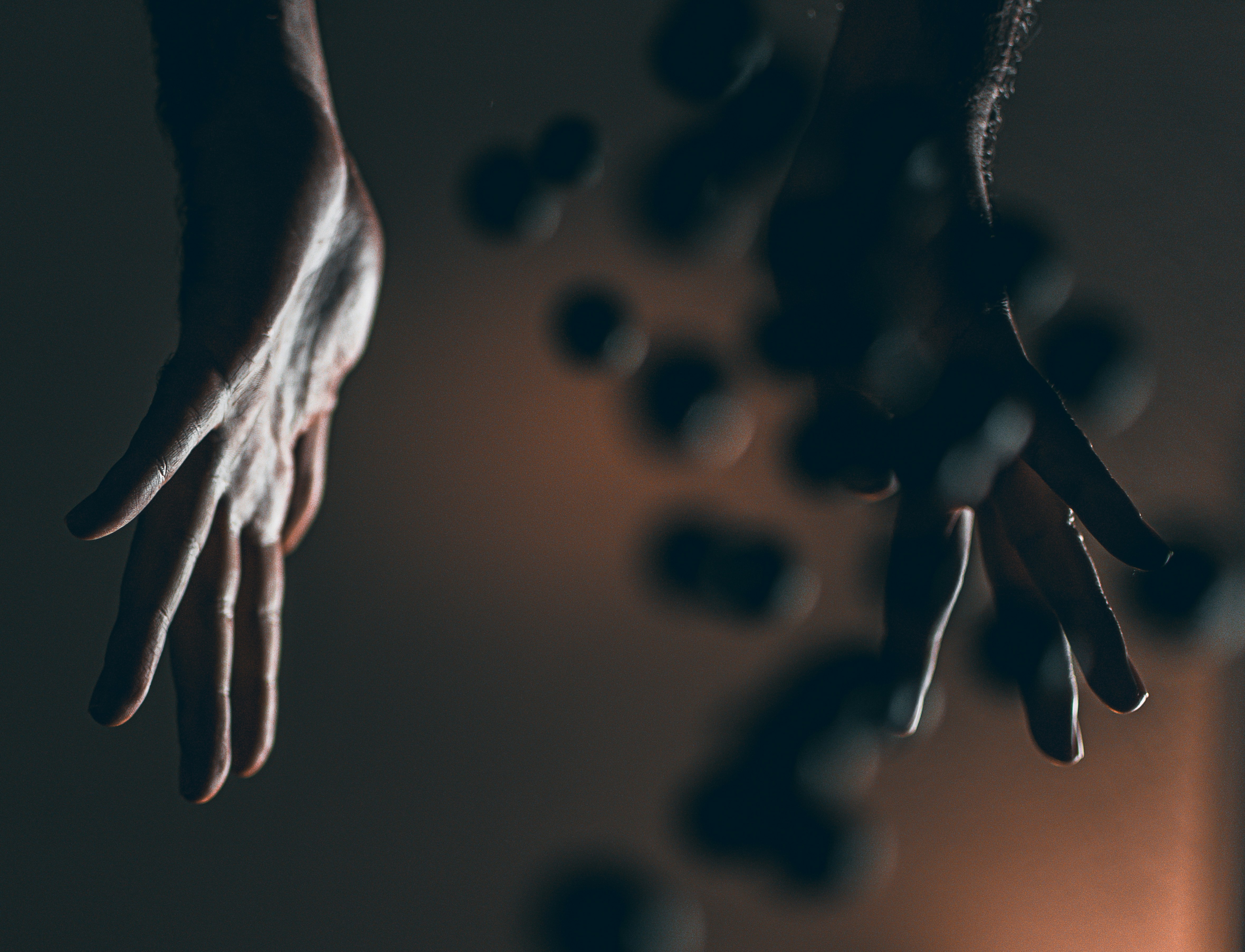 a person's hand reaching for something in the air