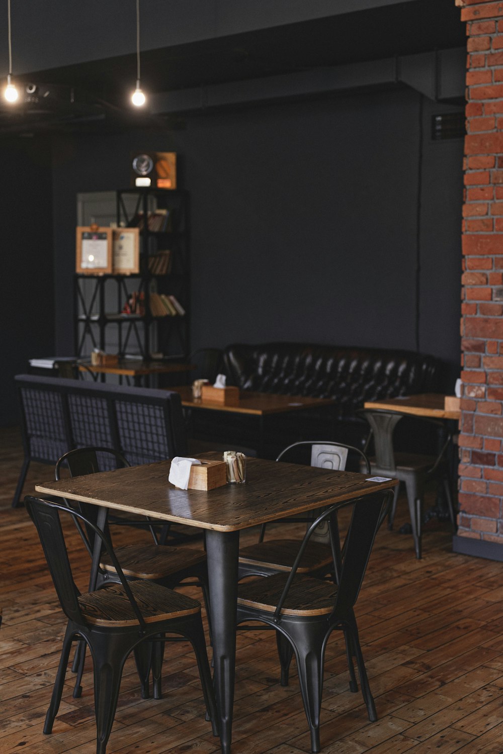 a kitchen with a table and chairs in a room