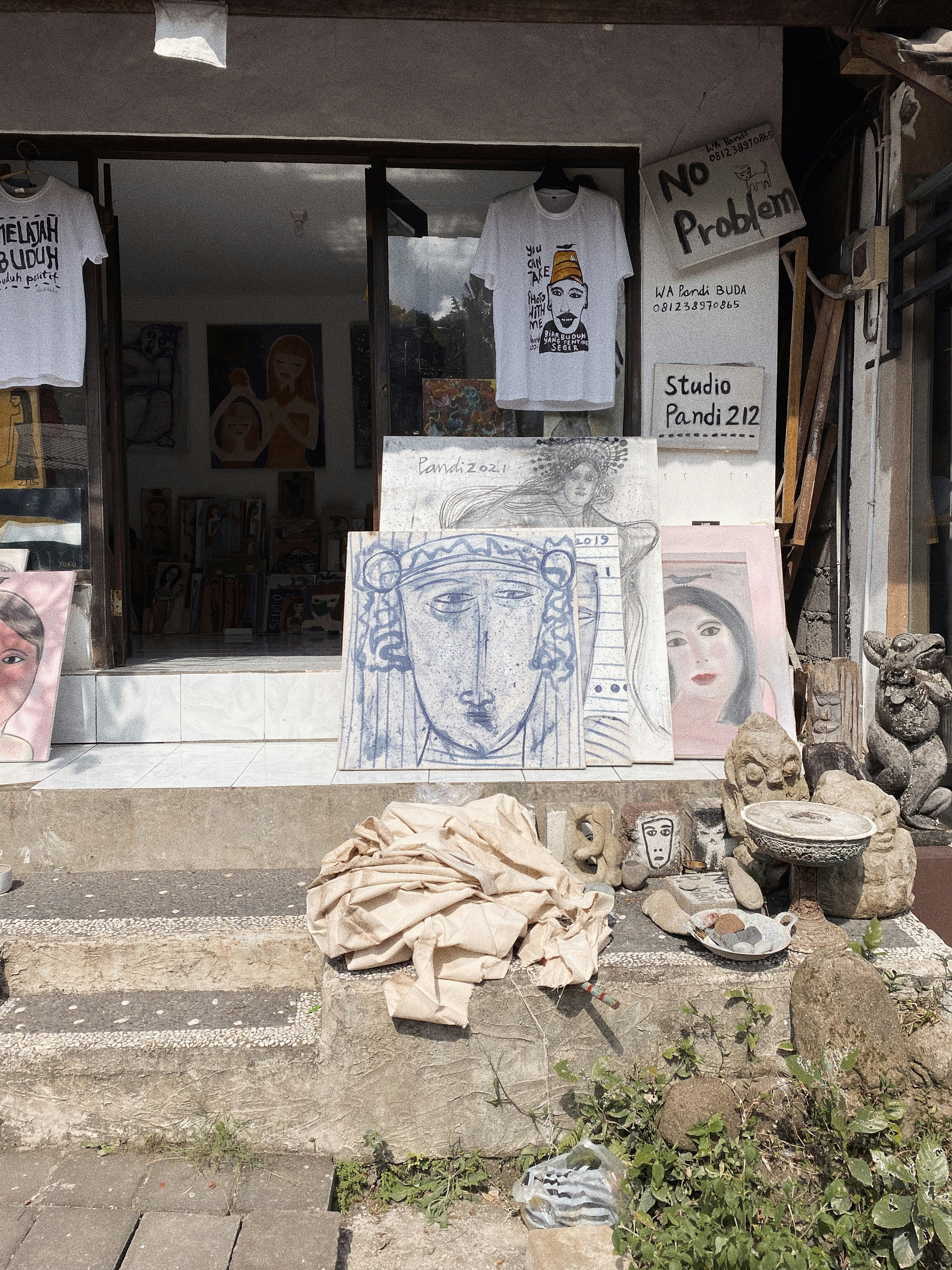 a store front with a bunch of items outside of it