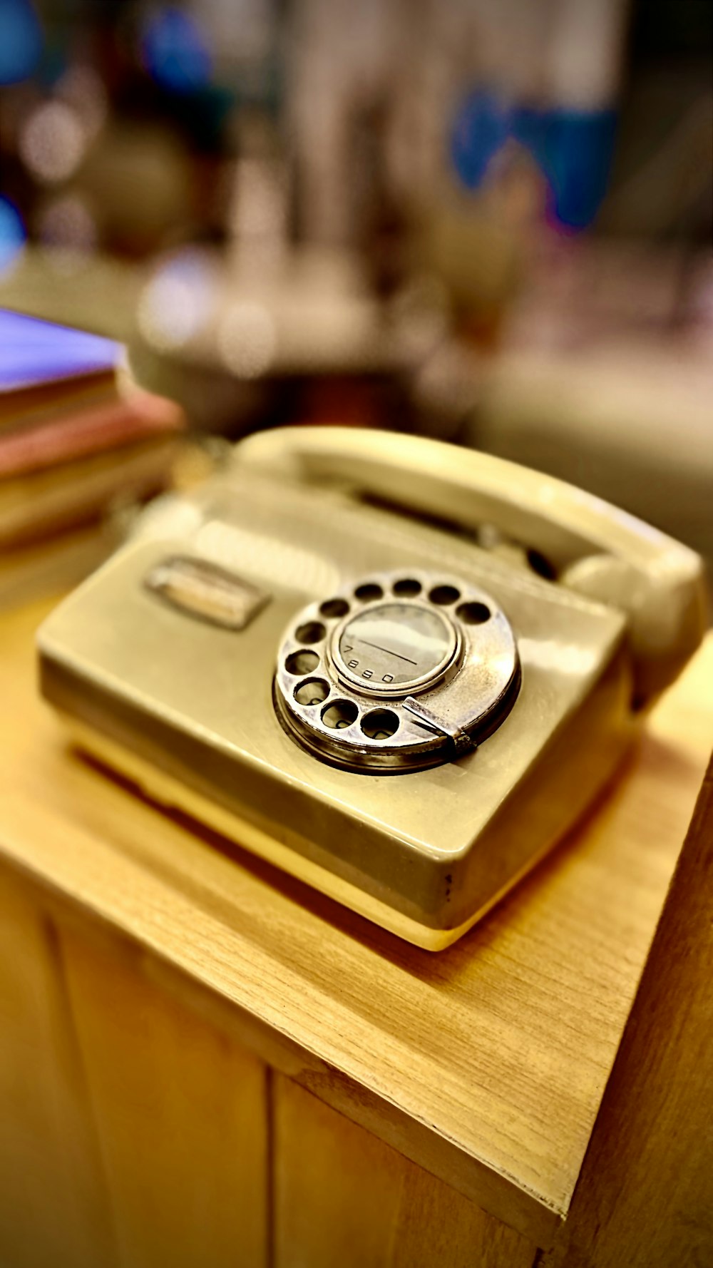 a phone sitting on top of a wooden table