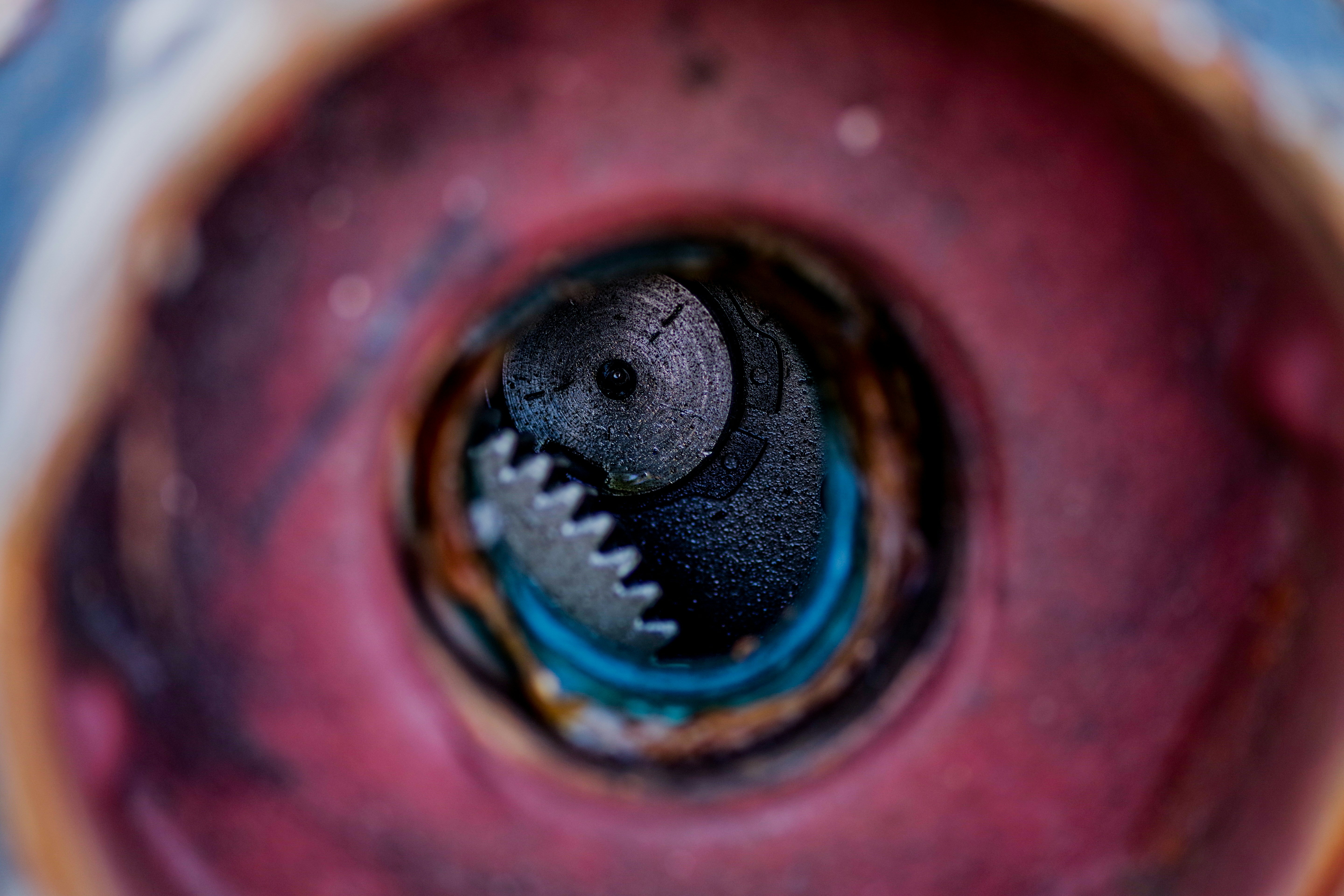 a close up of a metal object with a hole in it