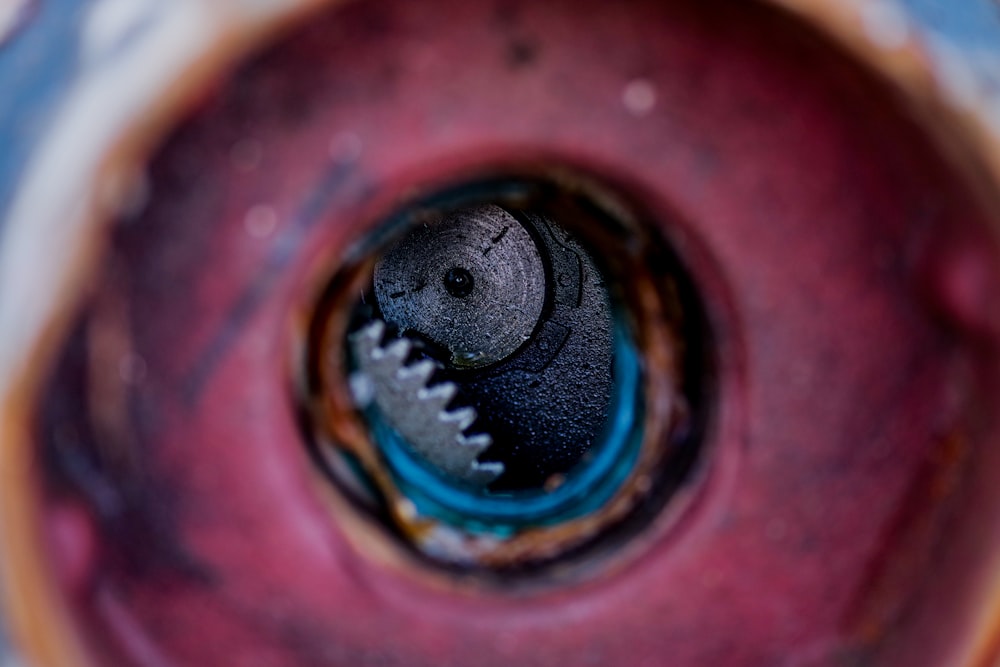 a close up of a metal object with a hole in it