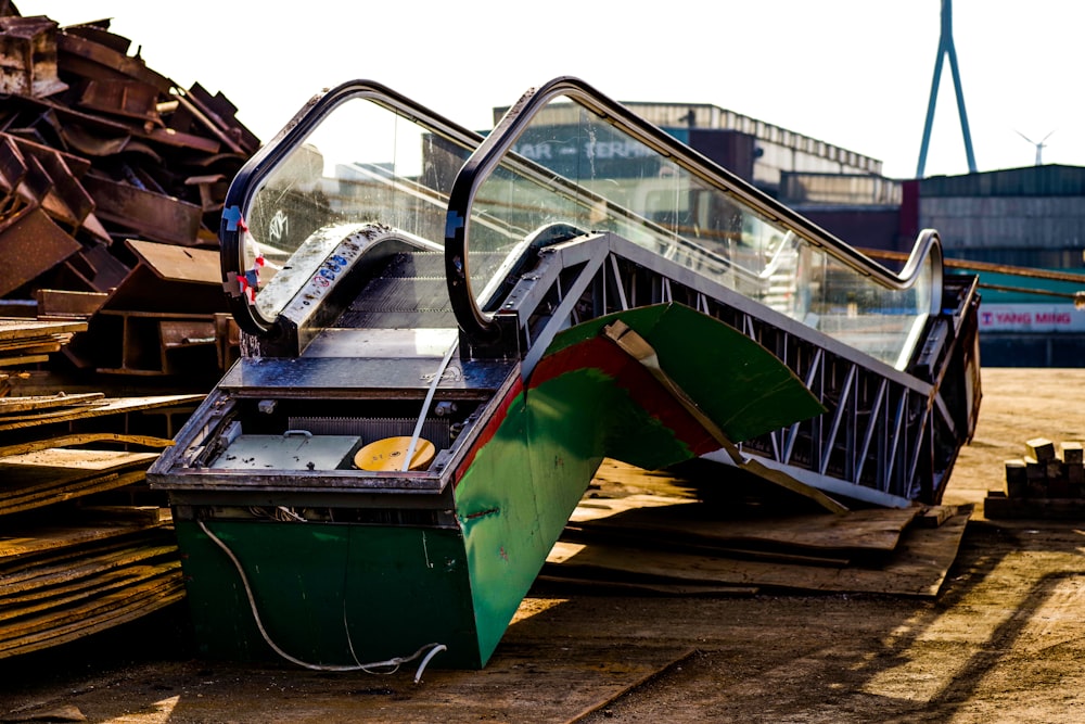 an escalator sitting on top of a pile of wood