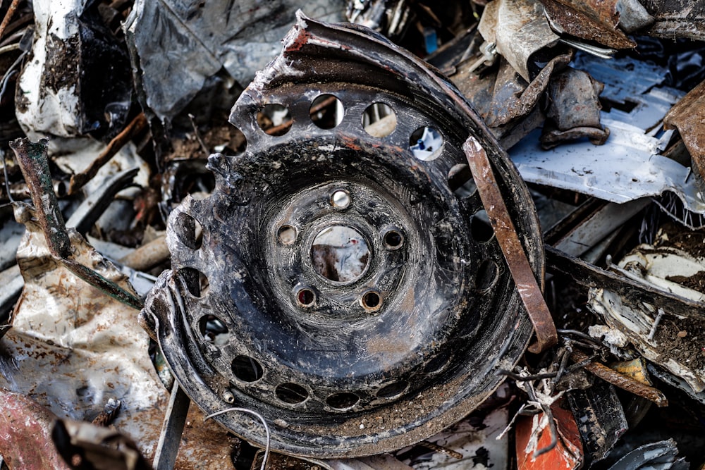 a close up of a rusted metal object on the ground