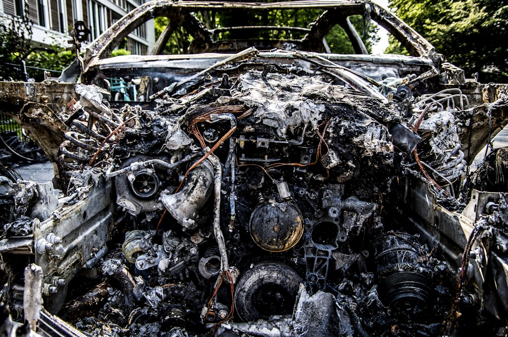 a car that has been burned and is parked