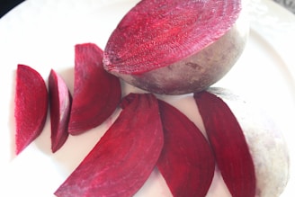 a white plate topped with sliced up beets