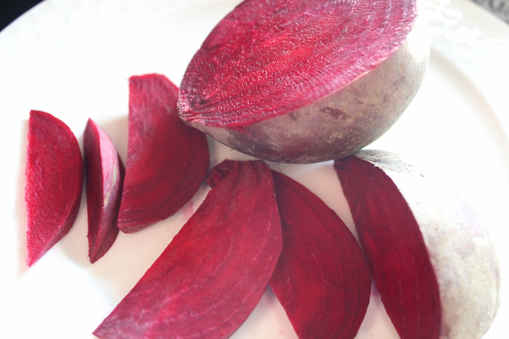 a white plate topped with sliced up beets