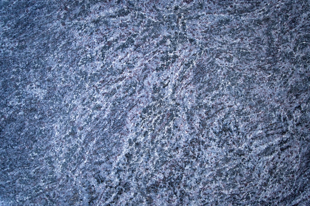 a close up view of a blue carpet