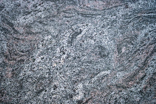 How to Care for Granite Countertops: Close-up of a black and white granite surface