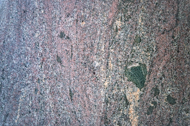 Close-up of rough granite block showing texture and color variations