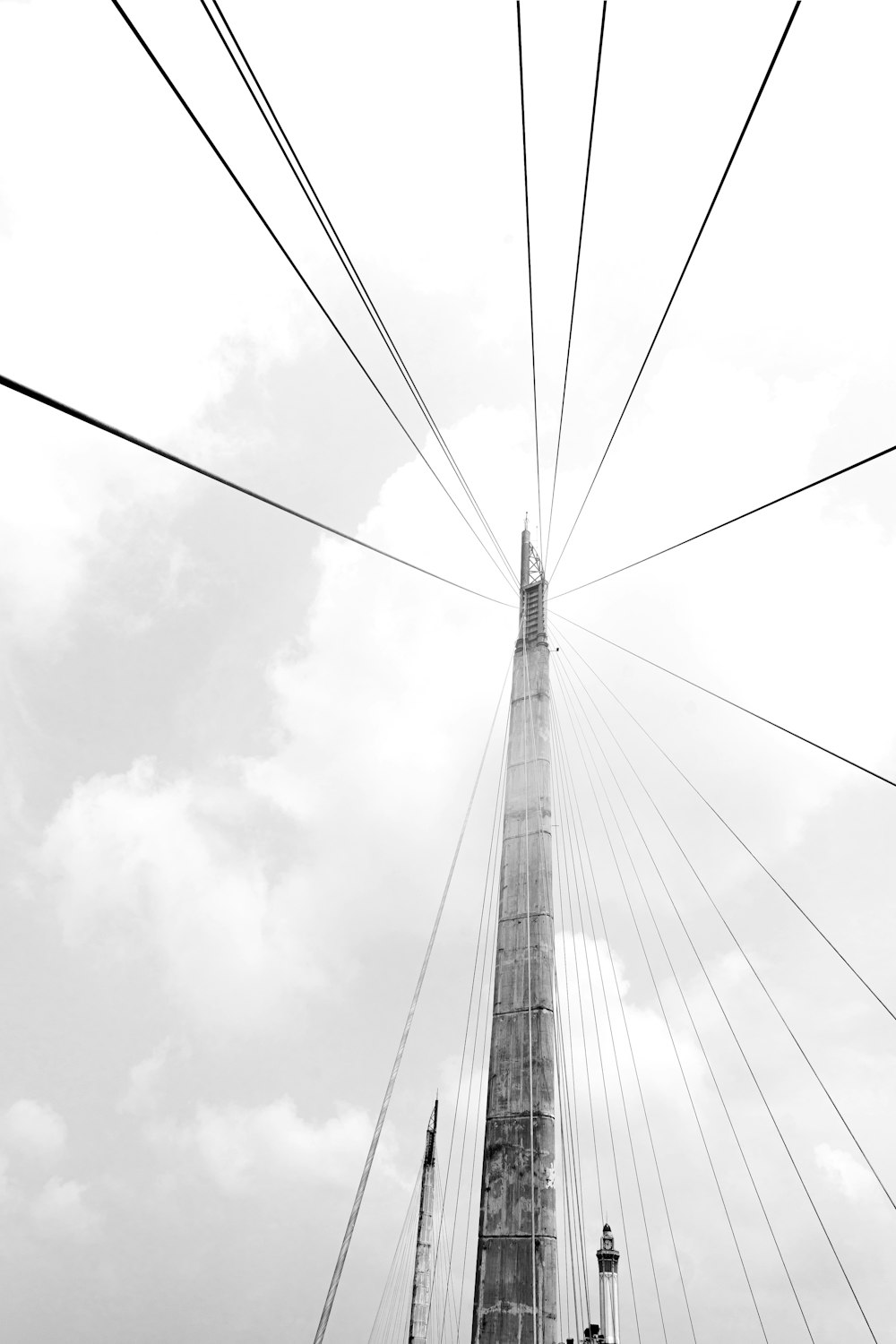 a black and white photo of a tall tower