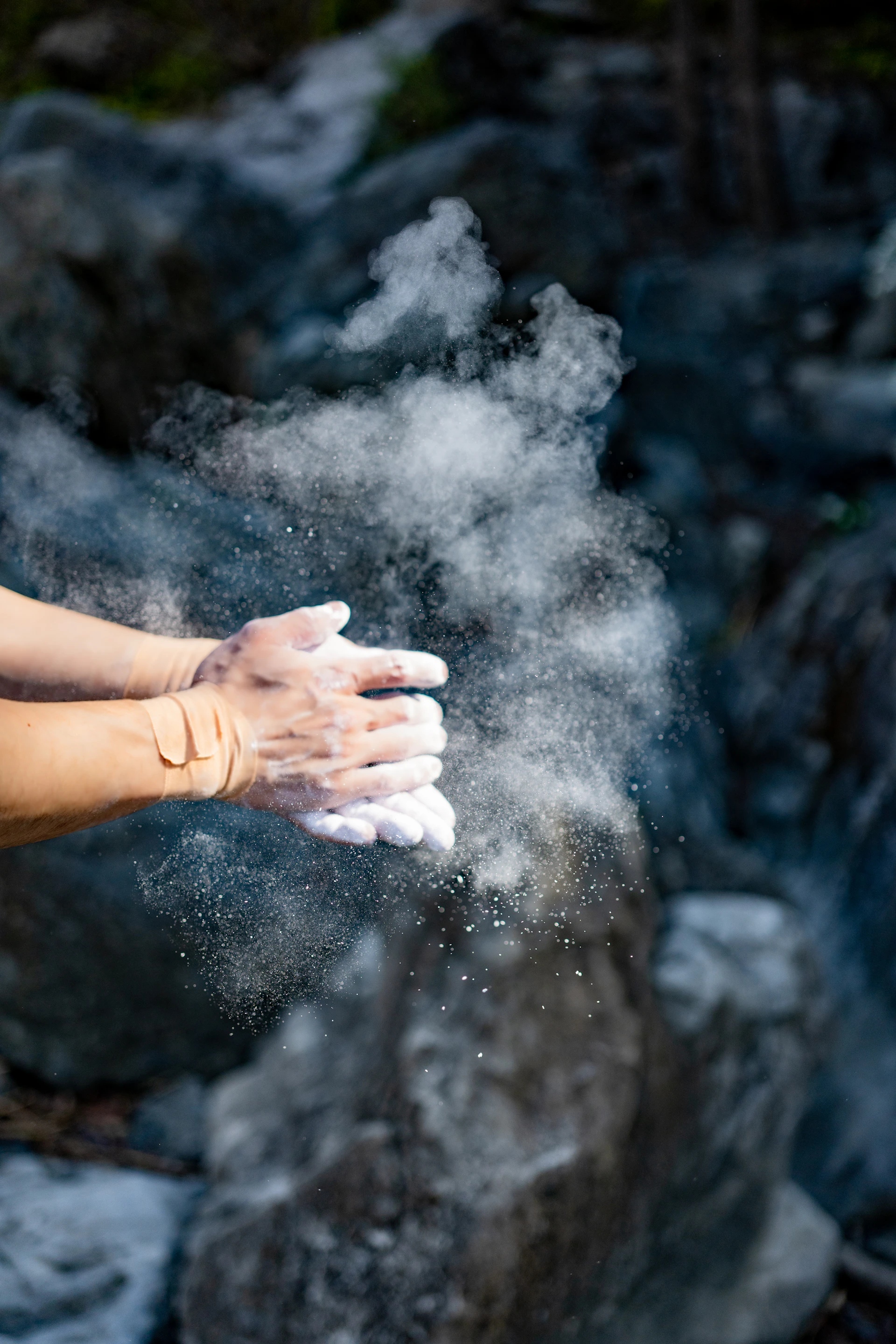 a woman holding out her hand with a lot of smoke coming out of it