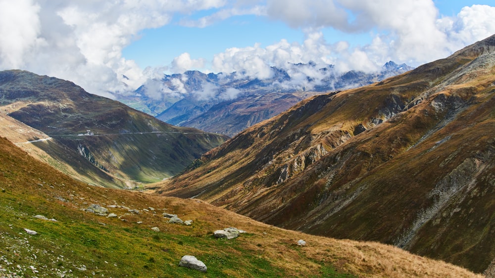 a view of a valley with mountains in the background