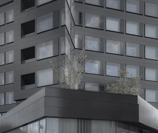 Glass facade with aluminum cladding on a commercial building.