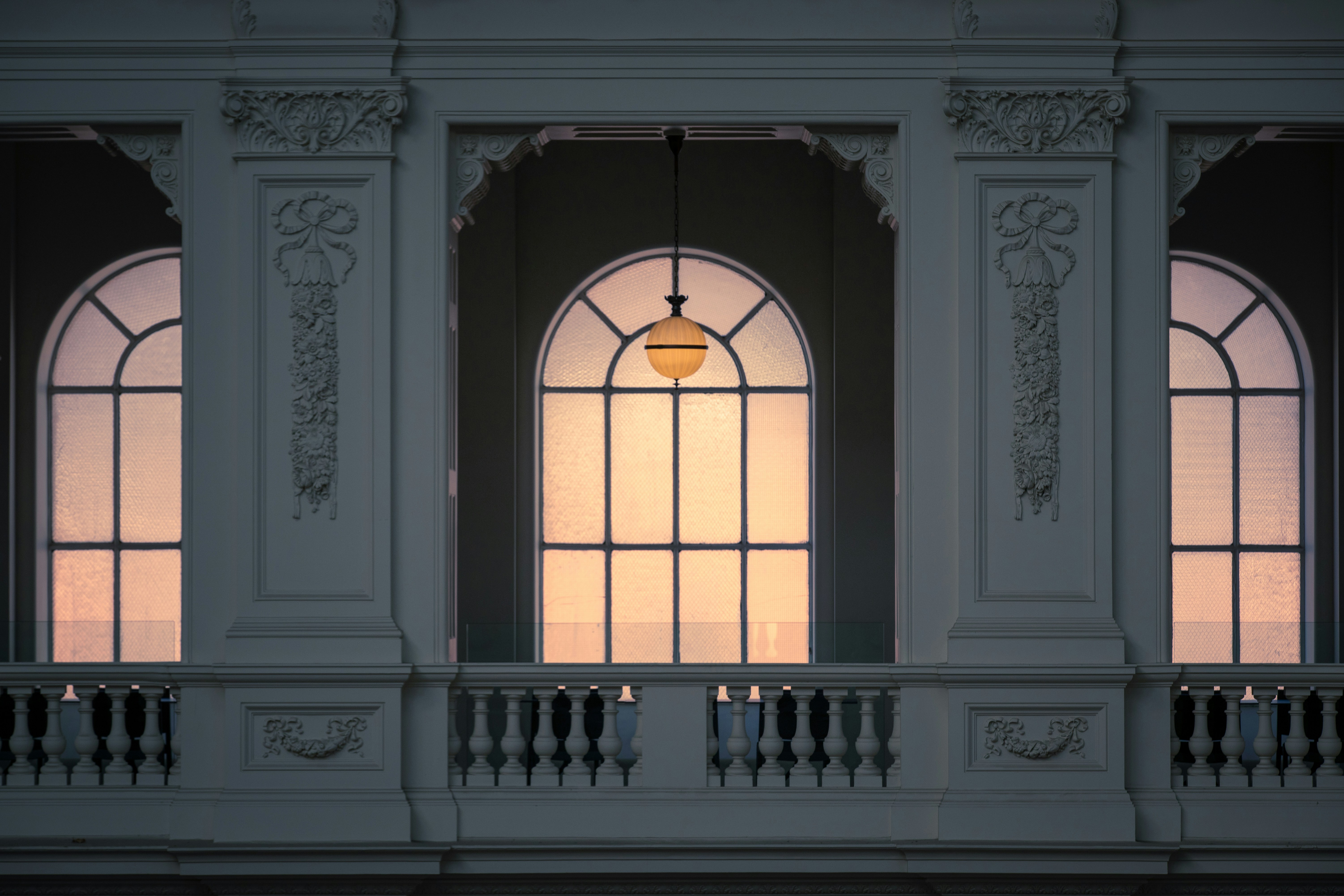 a window with a light hanging from it's side