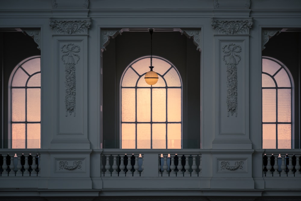a window with a light hanging from it's side