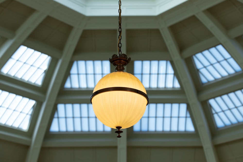 a light fixture hanging from a ceiling in a building