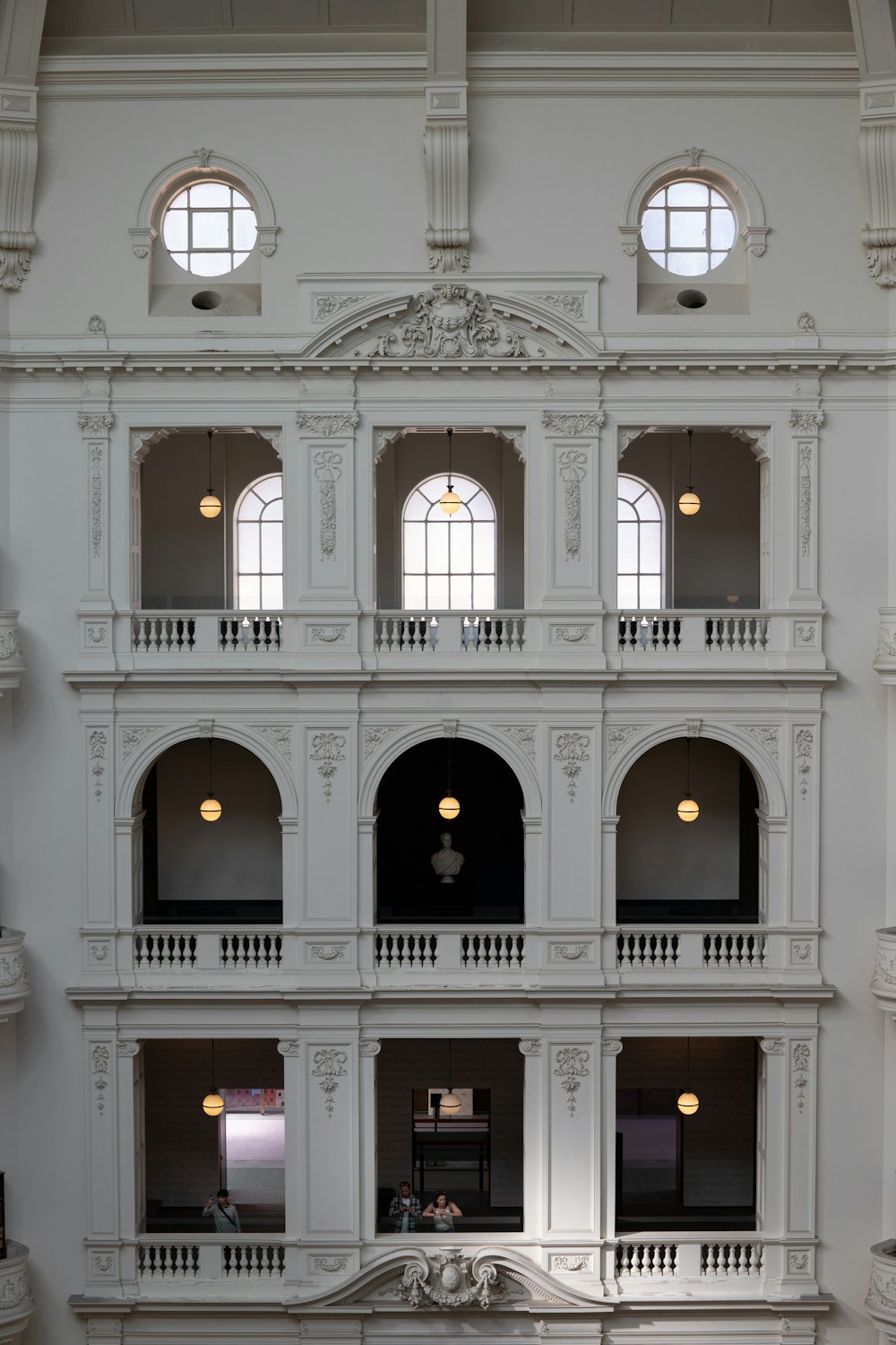 a large white building with many windows and balconies