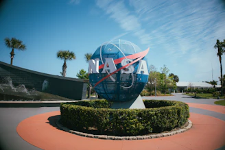 a blue and white globe with a nasa logo on it