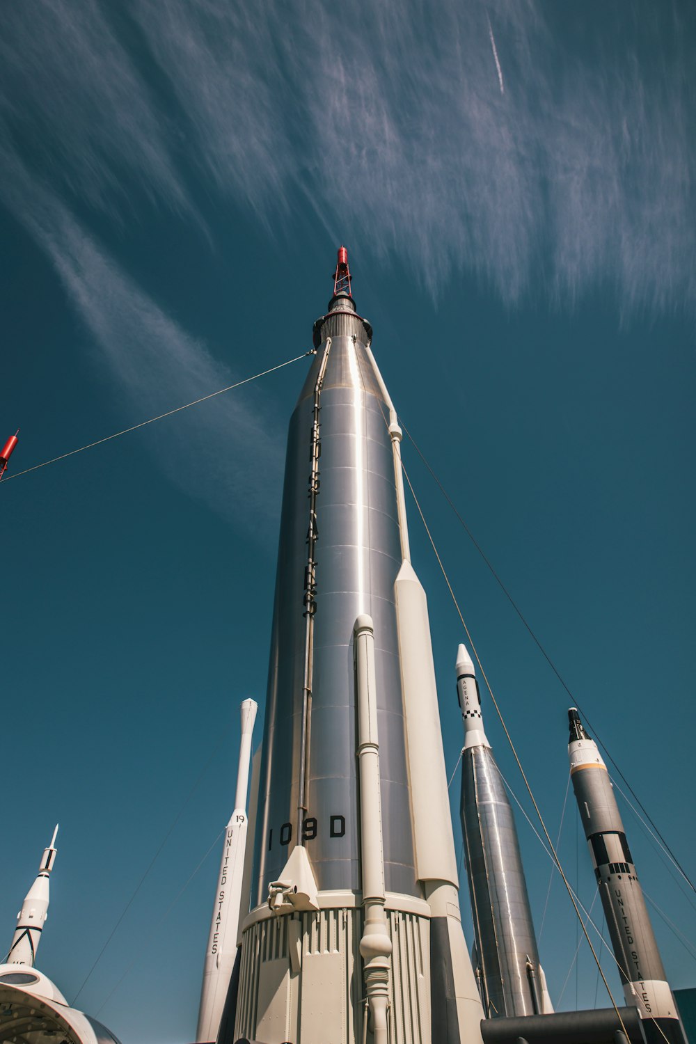 a large metal rocket sitting on top of a building