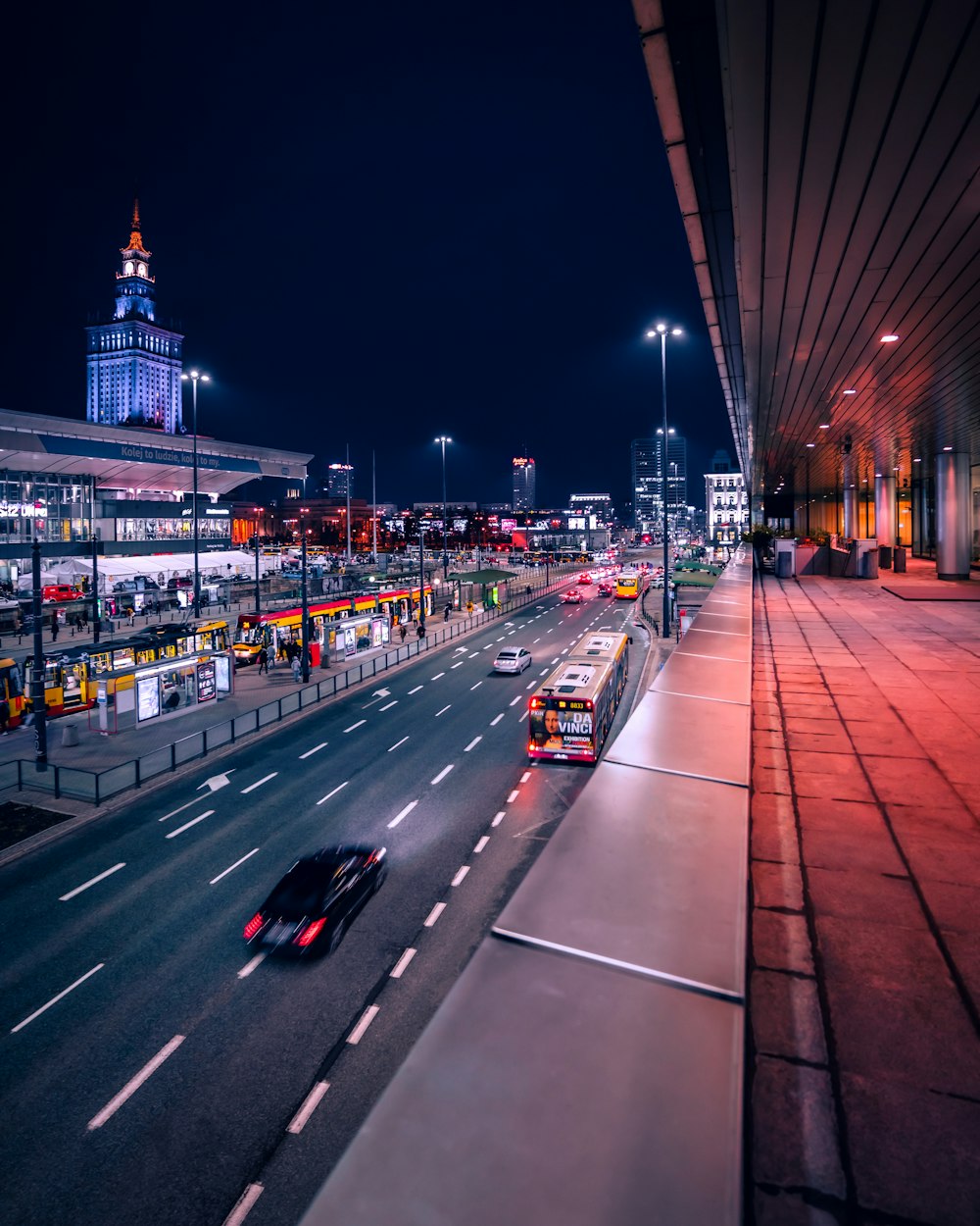 a city street at night with a lot of traffic