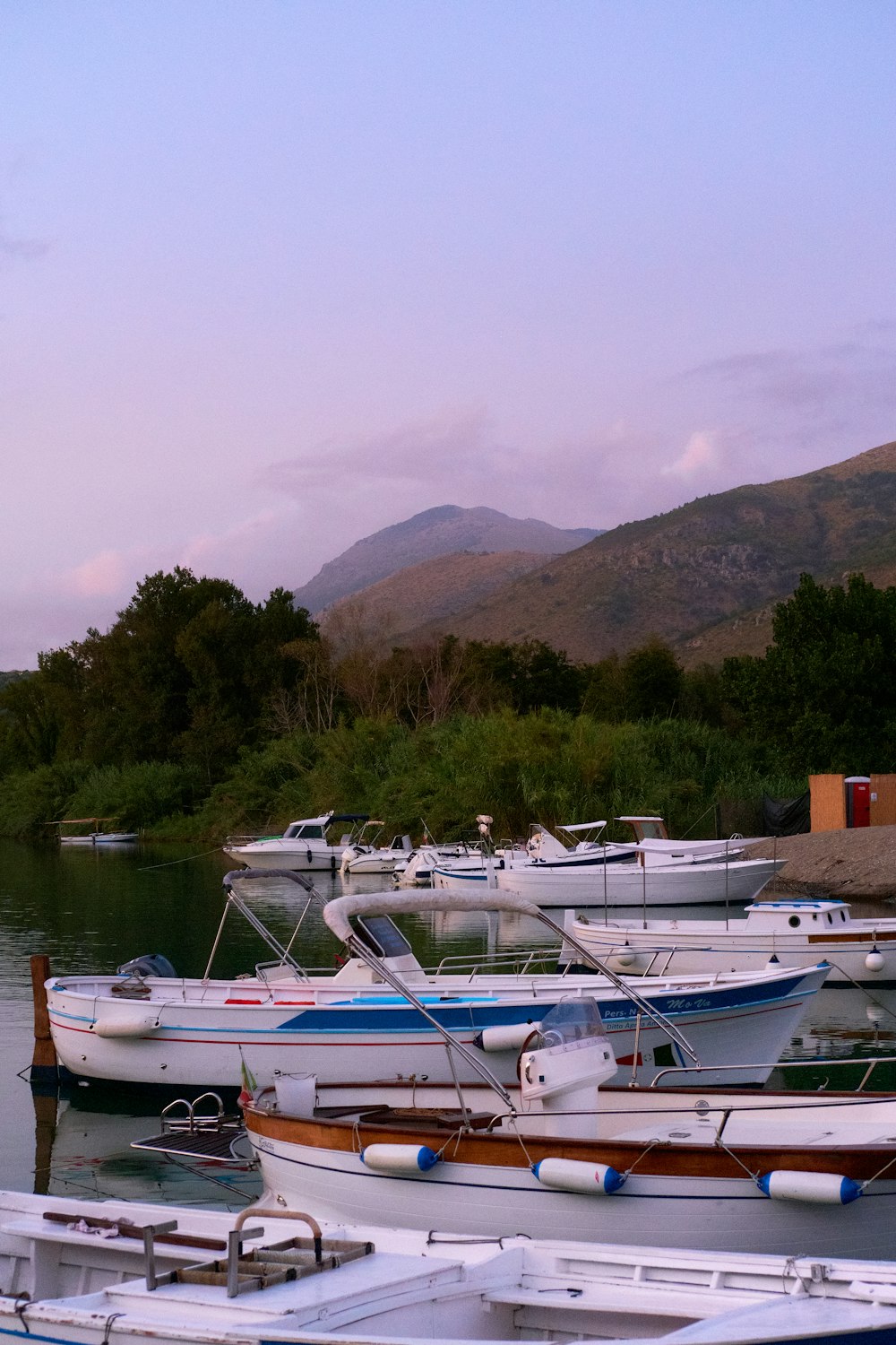 a bunch of boats that are sitting in the water