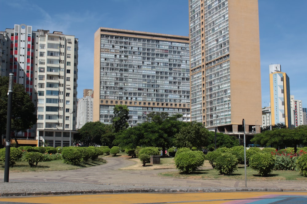 a couple of tall buildings sitting next to each other